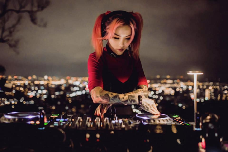 Taiwanese DJ and producer HER performing at a rooftop bar in the capital Taipei on Pioneer DJ equipment.
