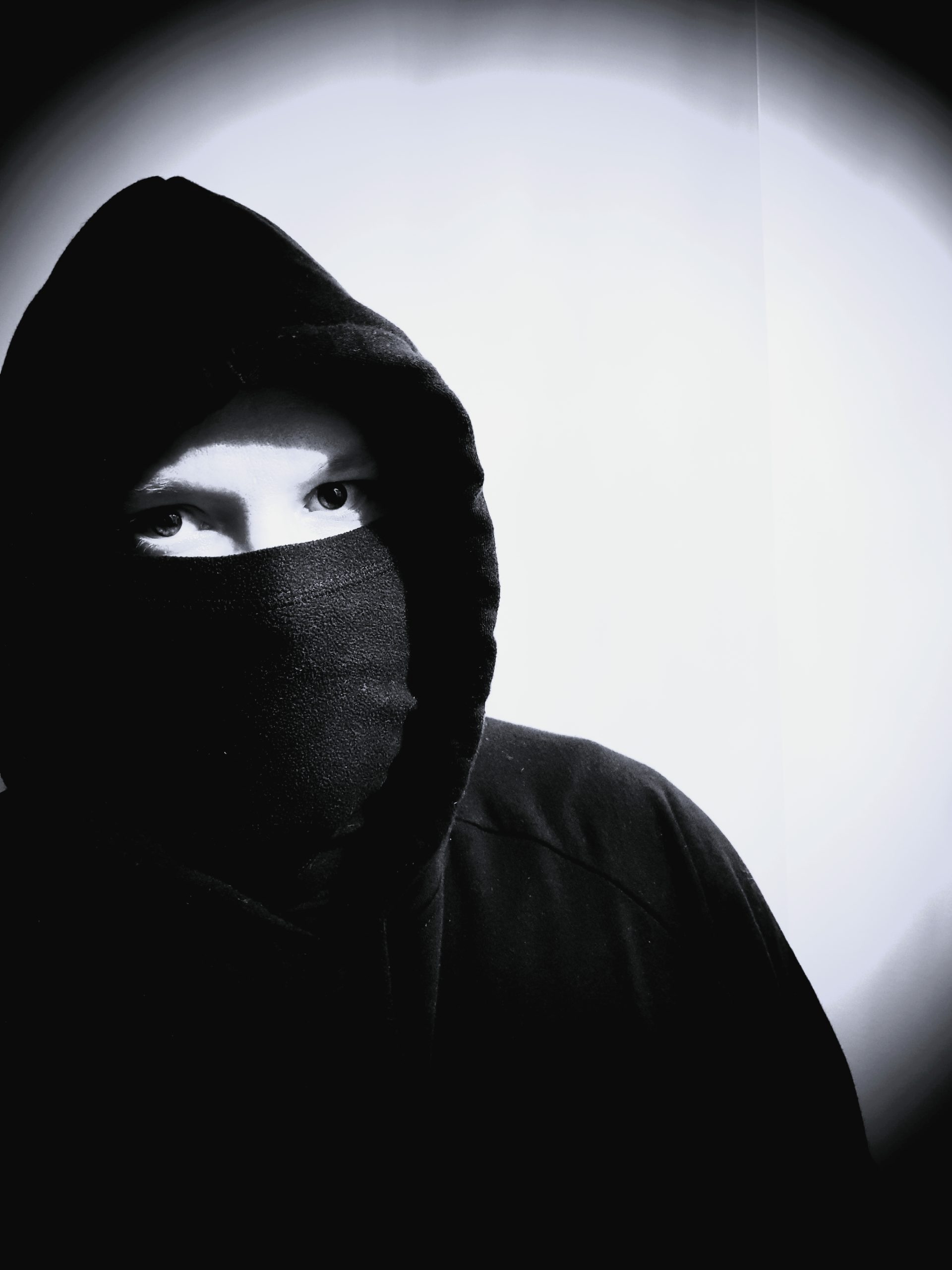 Norweigan DJ and producer Stefan Nite wearing a hood and facemask, black and white image.