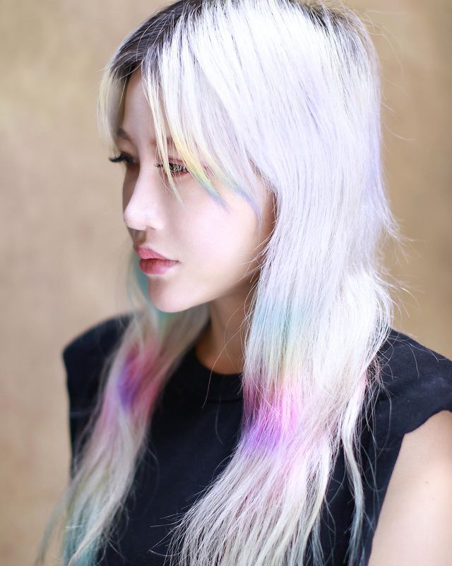 Taiuwanese DJ and producer Zora Hung standing in upper body shot looking to her right, colour image.