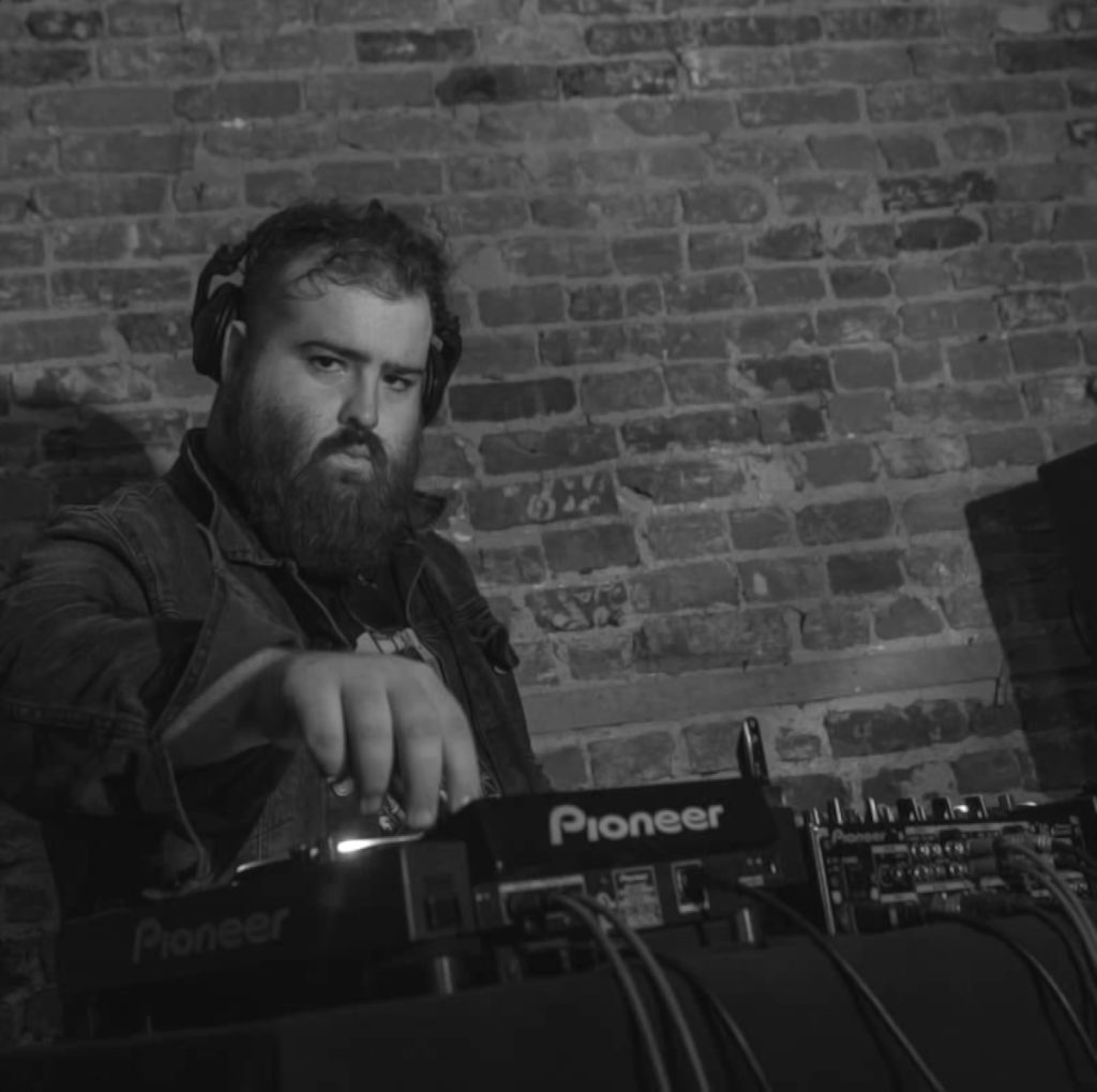 Canadian DJ De Frenza performing on Pioneer DJ Equipment at an event in Montreal