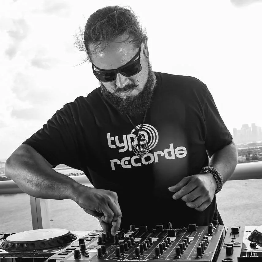 American DJ and producer Franccesco Cardenas of Typ3 Records performing at an event, black and white image.