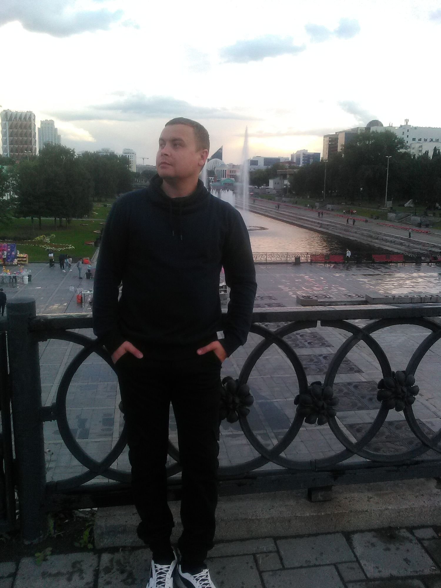 letaem standing on Bridge in Russia Looking up to the right