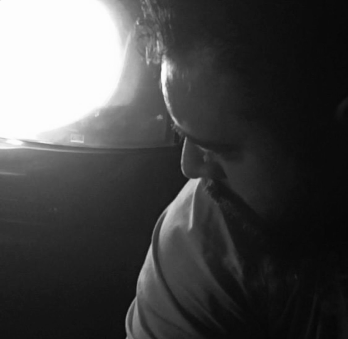 Romanian DJ Airden in side photo, black and white image.