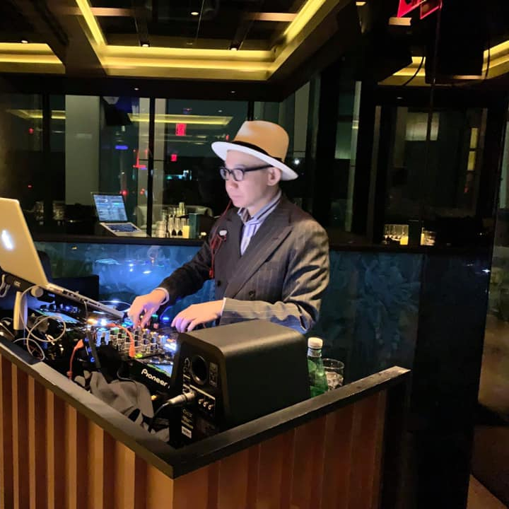 Taiwanese DJ and radio presenter Louis Chen performing on the decks at an event in Taipei, Taiwan, colour image