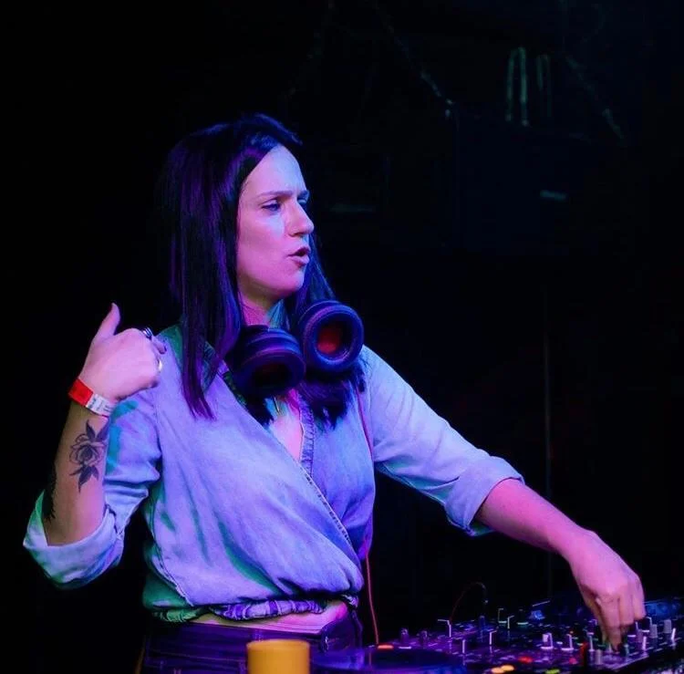 Brazilian DJ and producer Geysa Spinelli performing at an event, colour image.