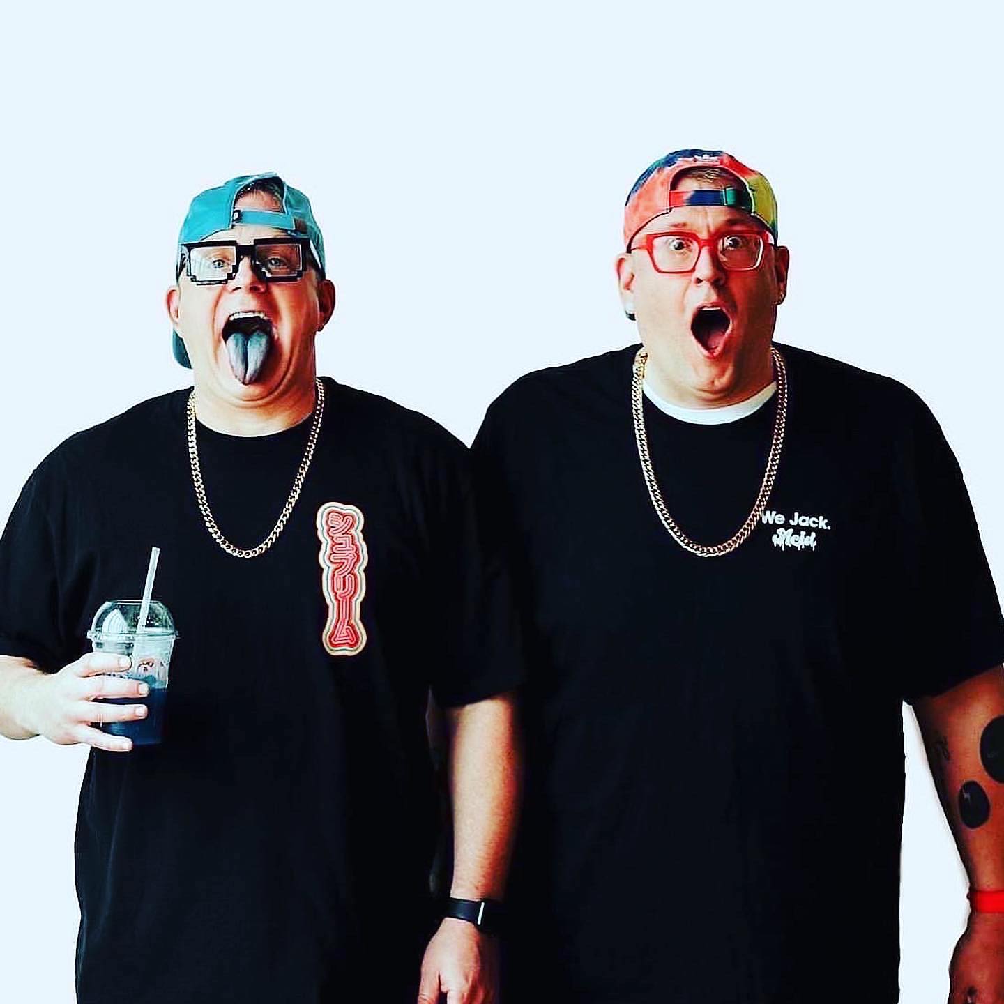 American DJ and production duo Gettoblaster standing with mouths open, colour image.
