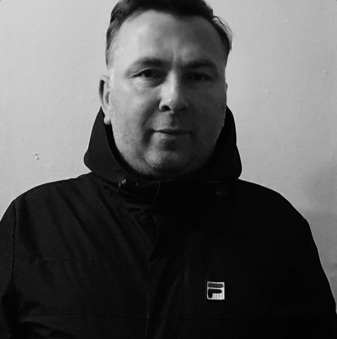Scottish DJ and Producer Robert Clark looking at camera, black and white image.