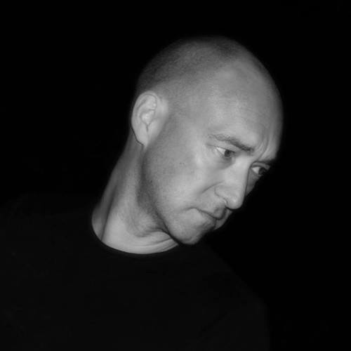 Belgian DJ and producer and AH Digital label co-owner Hypnotised looking down to his left, black and white image.