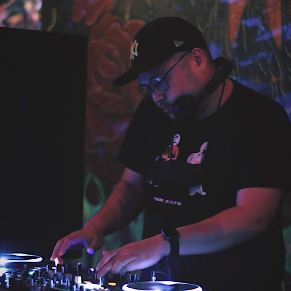 Indonesian DJ and producer Robin Rahardian performing at an event in Jakarta, colour image.