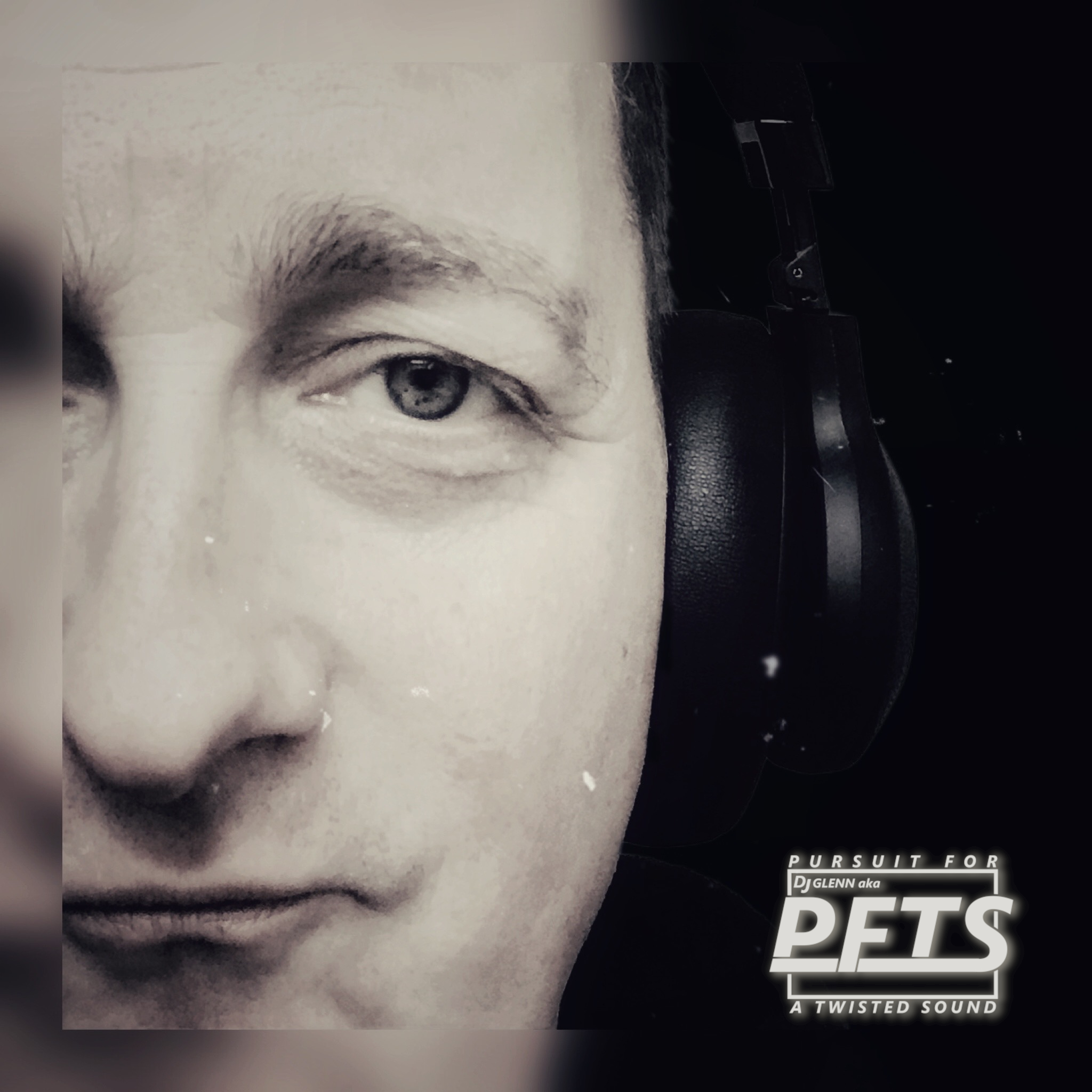 Belgian DJ and Producer PFTS a.k.a DJ Glenn, in half head shot wearing headphones, black and white image.