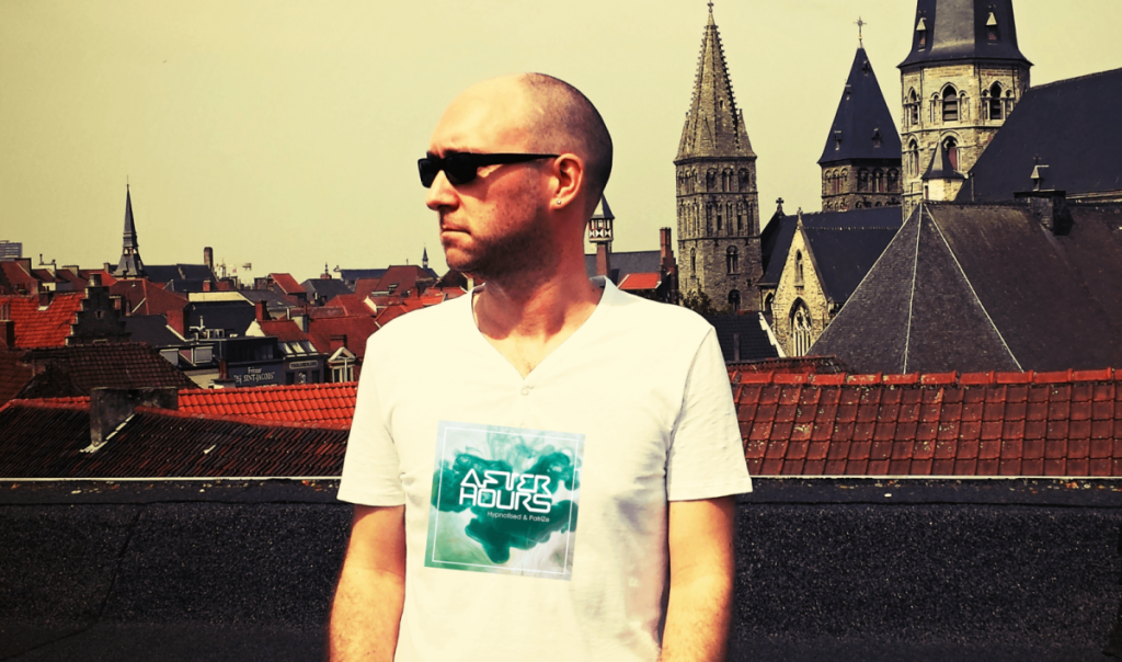 Belgian DJ and producer Hypnotised standing on a Rooftop in Belgium wearing sunglasses, colour image.