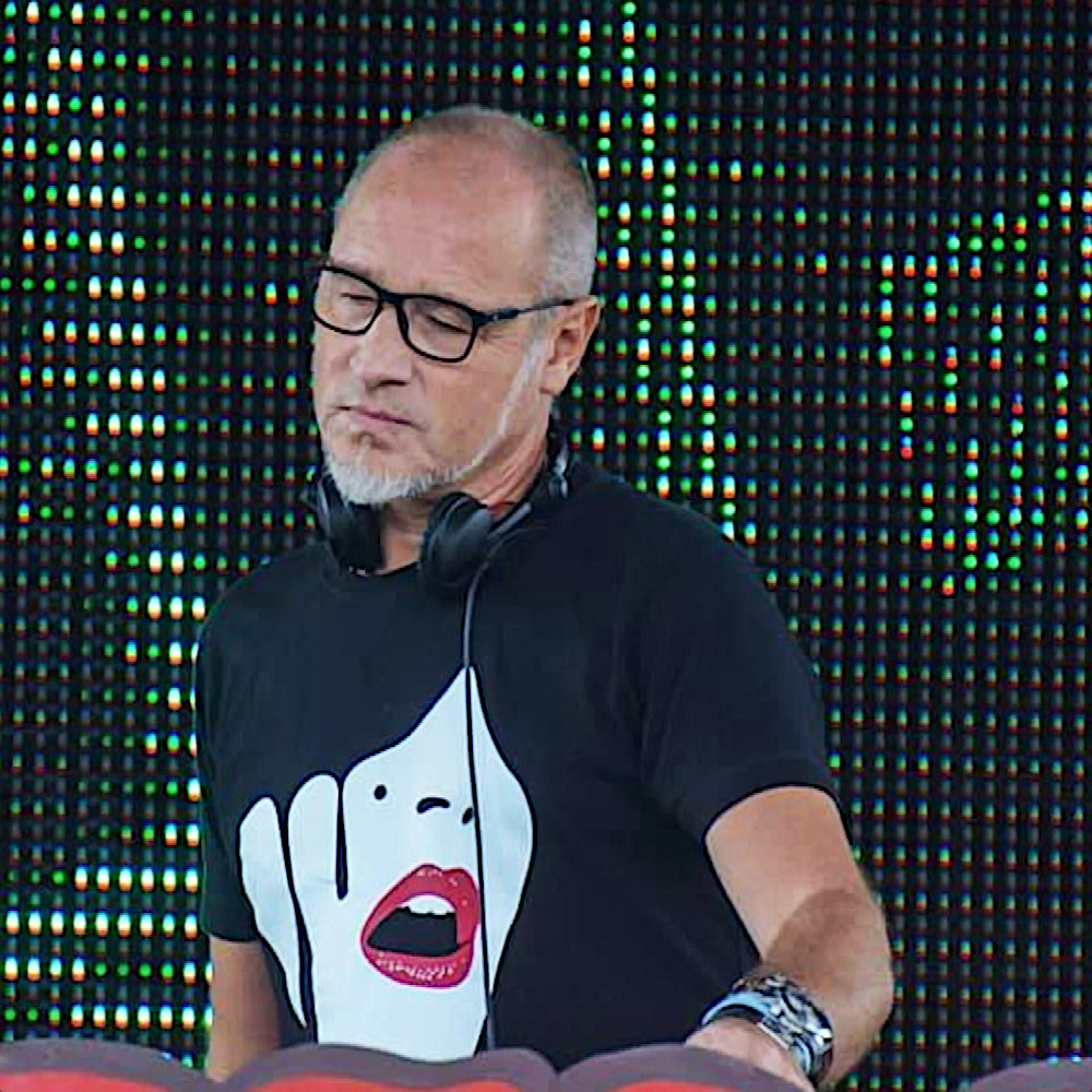 Belgian DJ and Producer Marc Denuit performing at a festival, colour image.