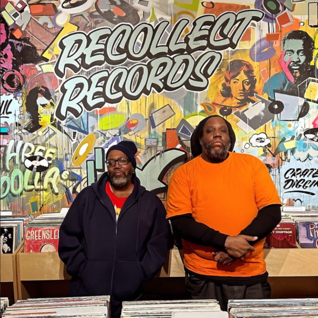 Hip Hop production duo Da Beatminerz photographed inside a record shop.