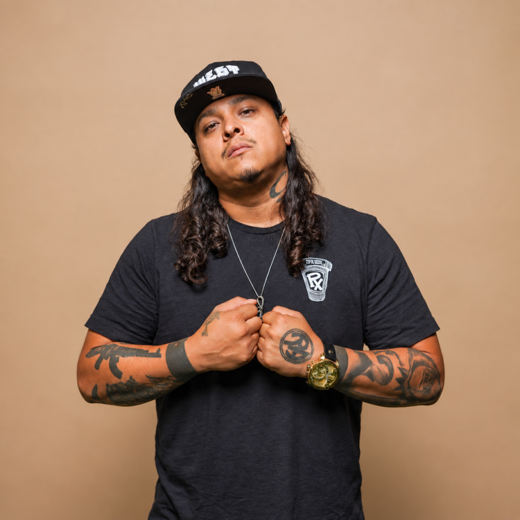 XP The Marxman, Los Angeles Hip Hop artist and guest on DJ King Flow's Mixtape Addict show on Scientific Sound Asia with his clenched fists together.